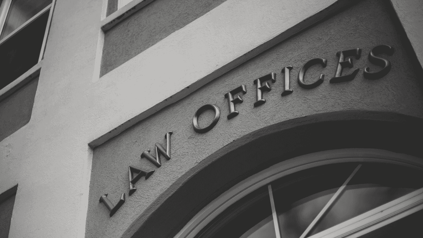 LAW OFFICES cut into the stone over a door.