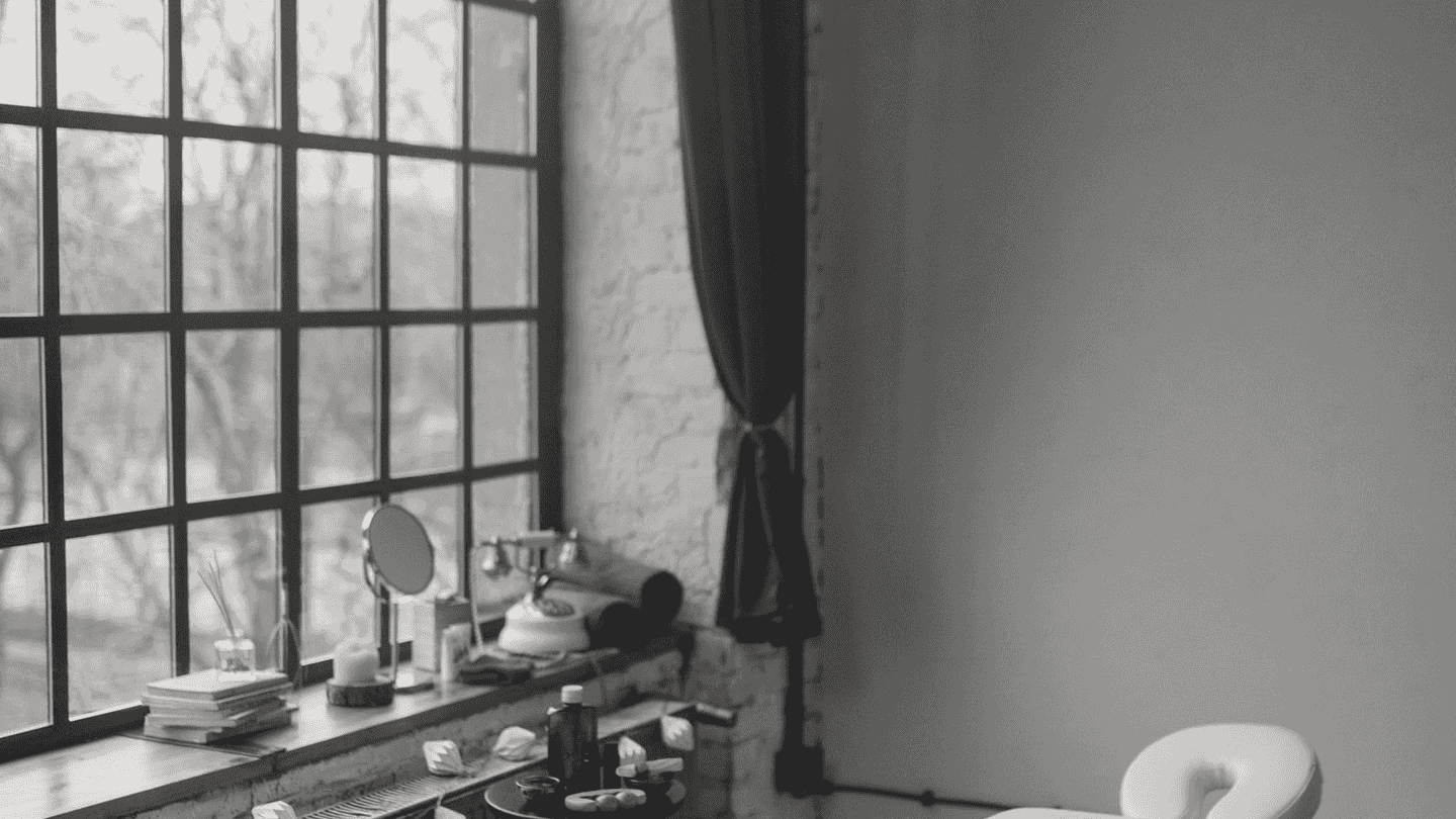 A treatment room with a tall window.